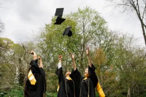 Graduates throwing caps in the air
